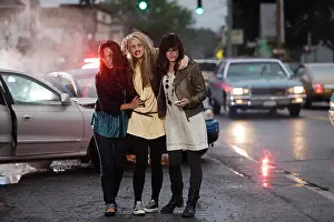 Dangerous Prints: Three young women walking away from automobile accident